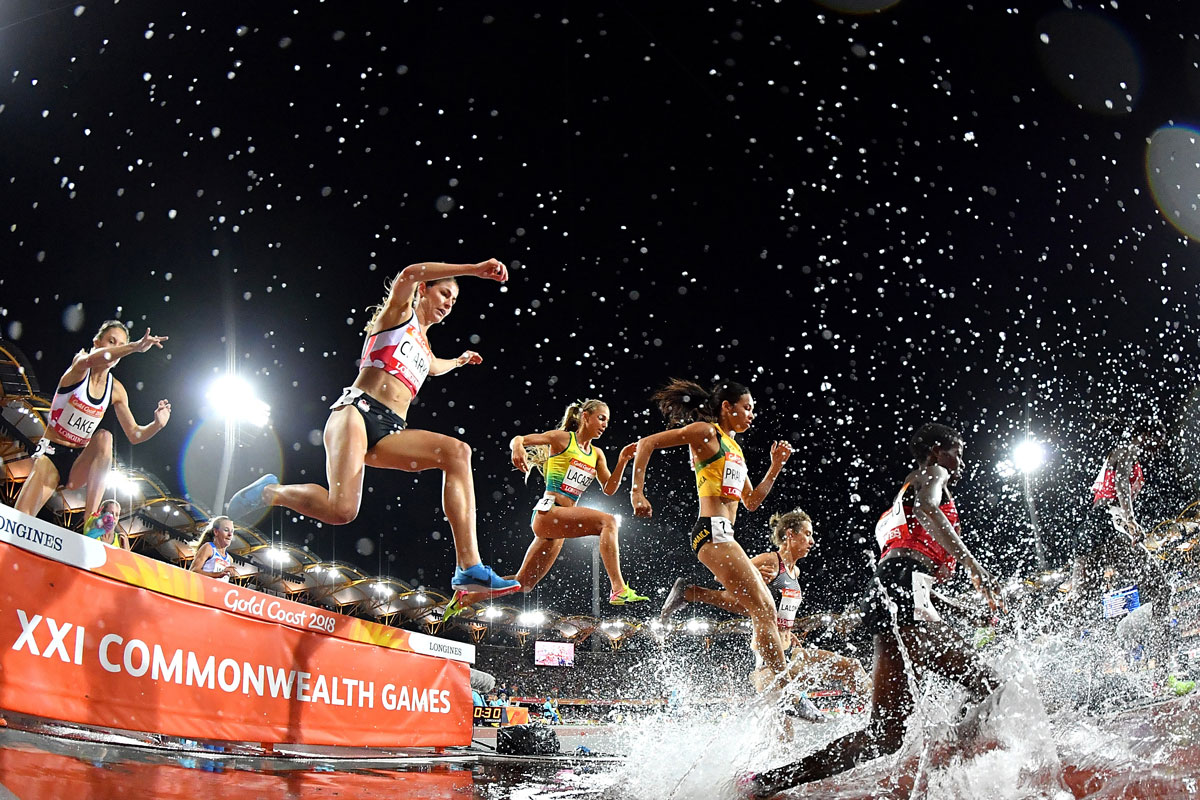 Aussie Genevieve Lacaze (centre) during the women's 3000m Steeplechase final on day seven of competition in the Commonwealth Games at Carrara Stadium on the Gold Coast.