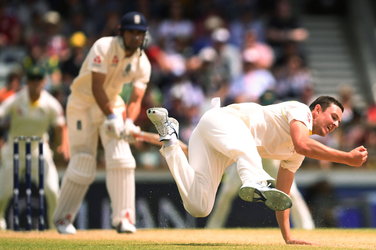 Australia's Josh Hazlewood catches England's Alastair Cook for 14, caught and bowled, on day four of the Third Test at the WACA in Perth, December 2017.