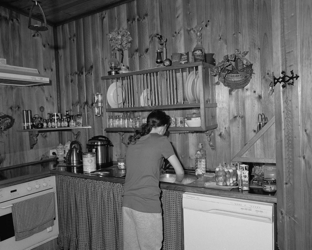 Emma Phillips, Untitled (Diane washing dishers at her father's house)